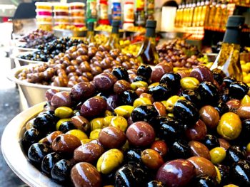 Bowls of fresh olives at an open air market