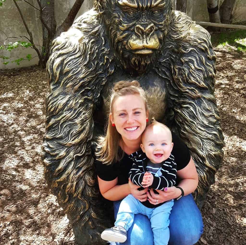 Mom and Baby in front of a gorilla sculpture at Hogle Zoo, Salt Lake City Utah