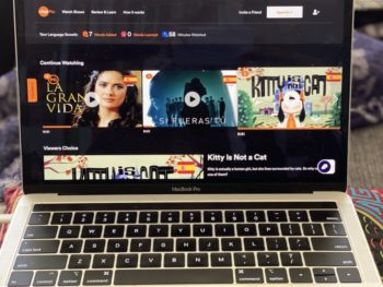 landing page of language learning app displaying tv shows, movies