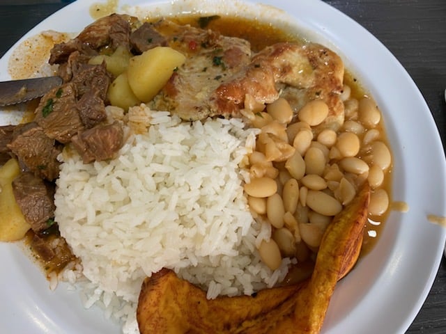 plate of typical Panamanian food. rice, beans, meat and plantains